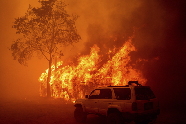 Flames consume a building in Butte County, California.