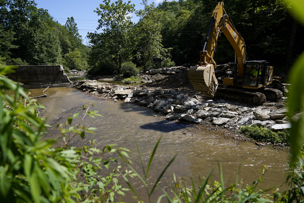 Crews work on the the removal of the Shulls Mill Dam on the Watauga River, near Boone, North Carolina.