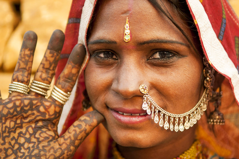indian woman wearing traditional clothes smiling to camera