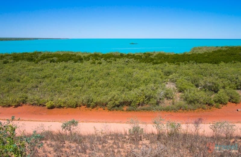 the colors of broome - red dust, green shrub, turquoise water, blue sky